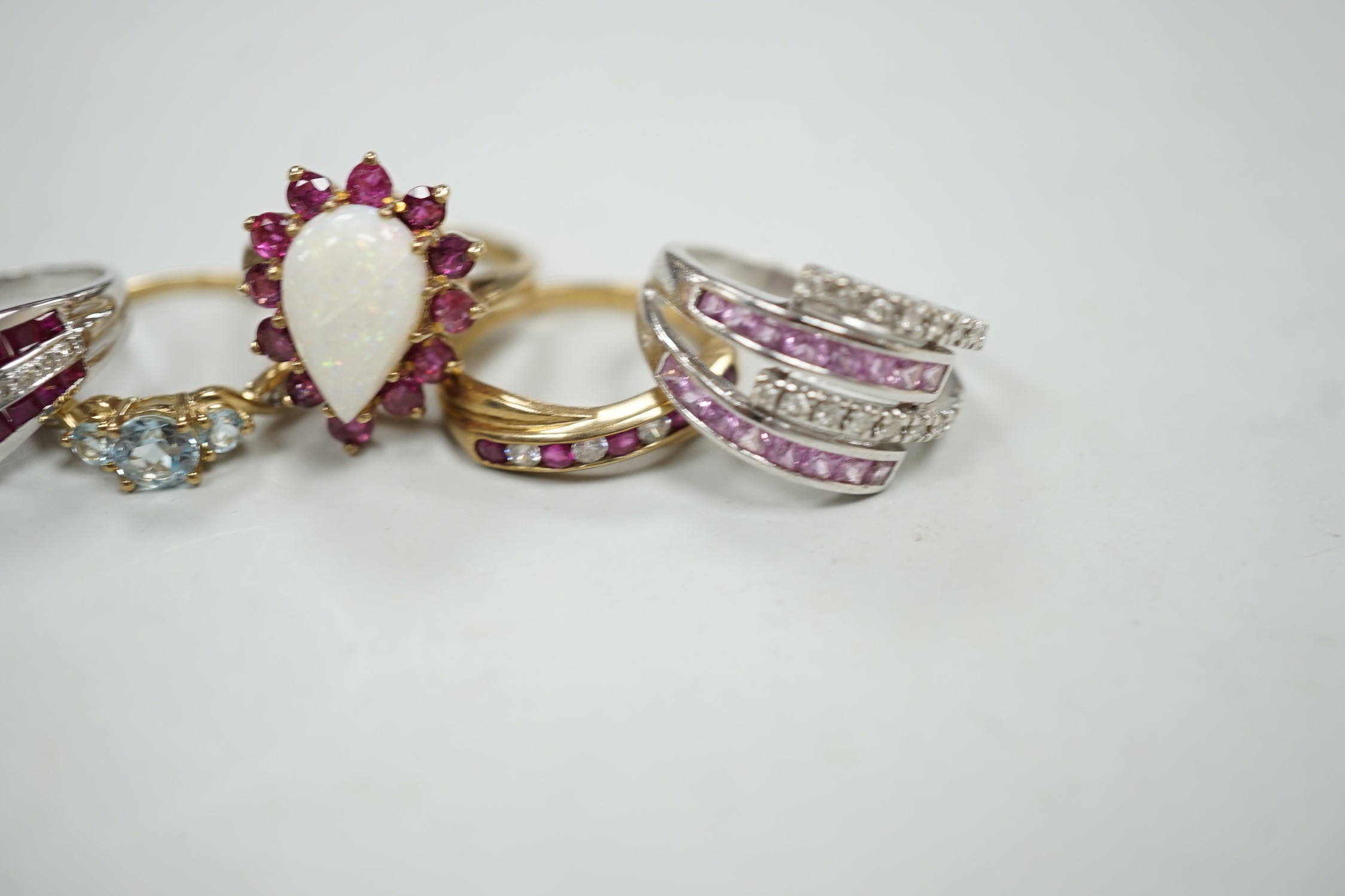 Five assorted modern 9ct gold and gem set dress rings, including ruby and diamond chip, gross weight 16.8 grams.